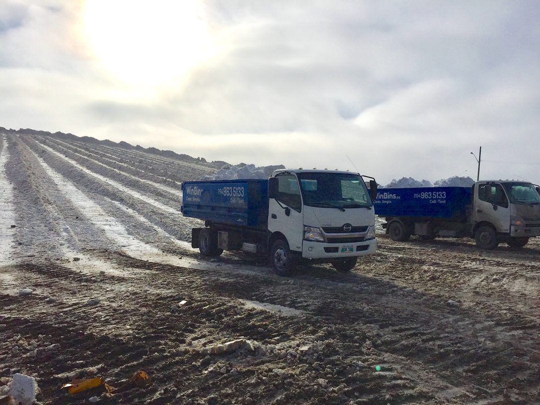 Winnipeg Bin & Dumpster Rentals by WinBins - 2 WinBins trucks at Snow dump